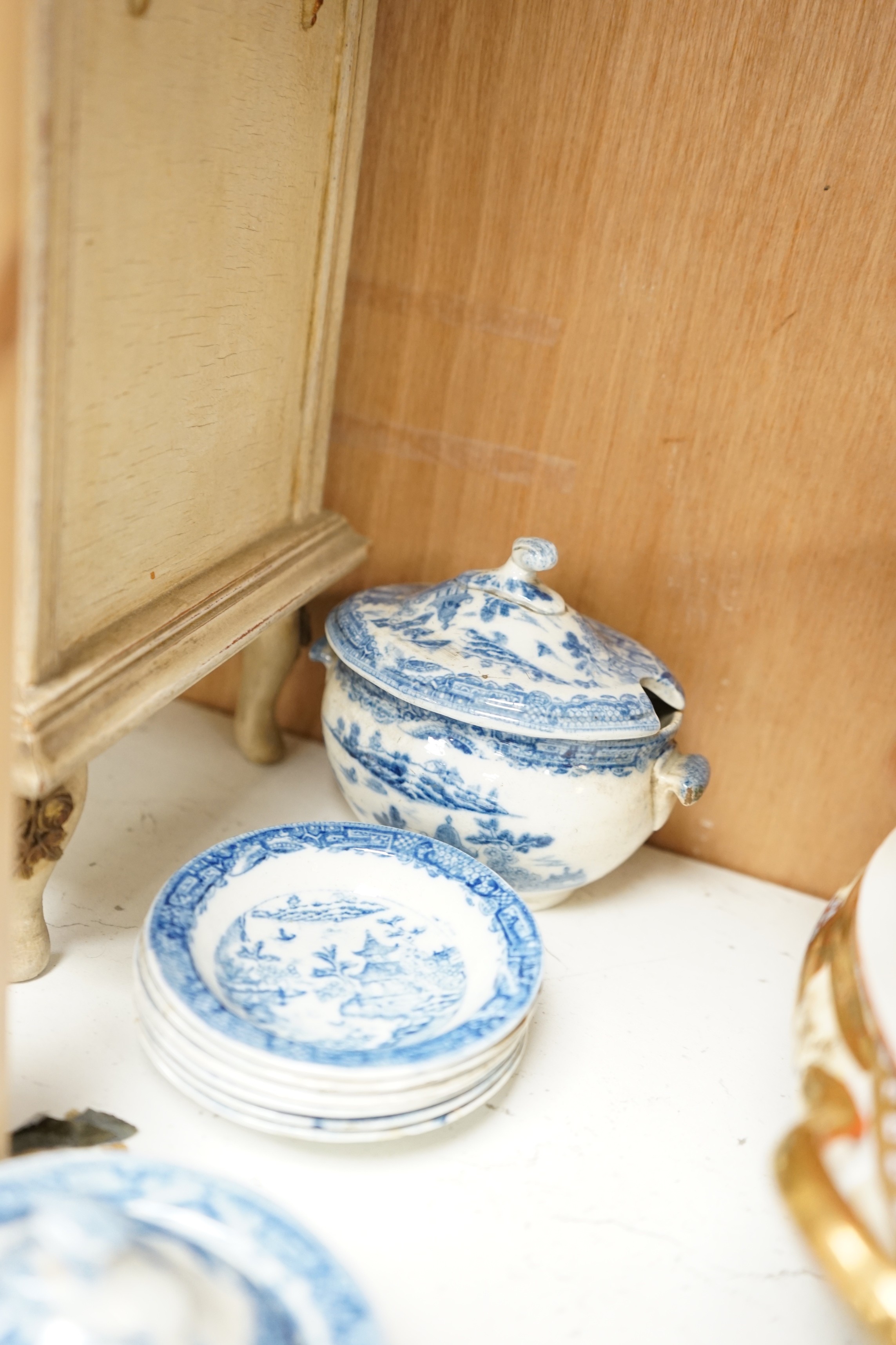 A Victorian toy-size blue and white dinner service and a painted wooden miniature chest, chest 27cms high